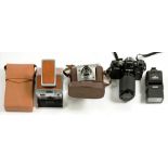 AN ILFORD SPORTSMAN 35MM CAMERA, A MINOLTA X700 CAMERA AND A POLAROID FOLDING CAMERA IN TAN LEATHER