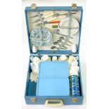 A 1960'S BLUE FABRIC COVERED PICNIC CASE, LABELLED BREXTON AND CONTENTS