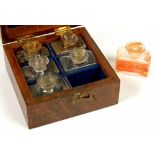 A SET OF SIX MEDICINE GLASS BOTTLES AND STOPPERS IN FITTED MAHOGANY BOX, 12.5CM L, BOTTLES 19TH C