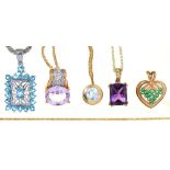 A TOPAZ PENDANT IN 9CT GOLD ON 9CT GOLD CHAIN, AN AMETHYST PENDANT IN GOLD MARKED 9K, ON GOLD