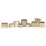 SIX VARIOUS SILVER NAPKIN RINGS, EDWARD VII AND LATER, 3OZS AND THREE PLATED NAPKIN RINGS (9)