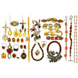A QUANTITY OF AMBER JEWELLERY IN SILVER, INCLUDING EIGHT PENDANTS, TWO NECKLACES, A BROOCH, FOUR