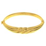 A GOLD BANGLE, MARKED 750, 13G++LIGHT WEAR CONSISTENT WITH AGE