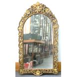 A SOUTH EAST ASIAN CARVED AND GILDED MIRROR, 140 X 79CM OVERALL