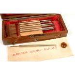 MEDICAL ANTIQUES. A SET OF EYE SURGEON'S INSTRUMENTS IN A VICTORIAN BRASS MOUNTED ROSEWOOD BOX, 18CM