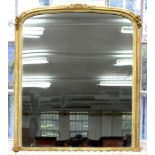 A VICTORIAN GILTWOOD OVERMANTLE MIRROR OF LOW ARCHED DESIGN, IN MOULDED FRAME WITH LATER