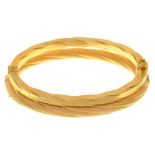 A 9CT GOLD BANGLE AND A GOLD BANGLE MARKED 375, 18G++LIGHT WEAR CONSISTENT WITH AGE