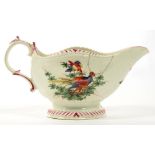 A WORCESTER POLYCHROME SAUCE BOAT, PAINTED WITH DISHEVELED BIRDS AND AN INSECT, THE RIMS AND