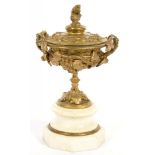 A VICTORIAN GILT BRASS URN AND COVER ON TURNED MARBLE SOCLE AND OCTAGONAL FOOT, 55CM H