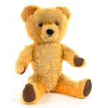 A MUSICAL GOLD PLUSH TEDDY BEAR