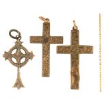 THREE GOLD CROSS PENDANTS, 9CT GOLD, MARKED 9CT OR UNMARKED, 4.5G AND A GILT BRASS CHAIN++DAMAGE AND