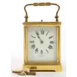 A BRASS CARRIAGE CLOCK, THE WHITE ENAMEL MASK DIAL INSCRIBED R JONES AND SONS LIVERPOOL, THE