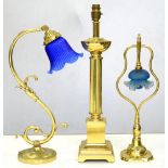 THREE VARIOUS BRASS TABLE LAMPS, ONE OF SWAN NECK FORM WITH BLUE GLASS SHADE, 45CM H