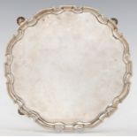 A GEORGE II SILVER SALVER on shell feet, 34cm diam, by John Swift, London 1736, 38ozs Light wear,