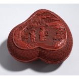 A CHINESE PEACH SHAPED CINNABAR LACQUER BOX AND COVER, 19TH/20TH C the cover carved with an immortal