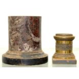 A MINIATURE TURNED MARBLE PEDESTAL ON SLATE BASE AND A MILLED GILT BRASS PEDESTAL, BOTH EARLY 19TH C