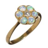 AN OPAL AND DIAMOND CLUSTER RING  in gold marked 18ct, 2.4g, size L½ Good condition, opals well