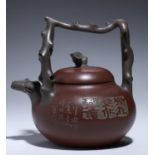 AN YIXING STONEWARE TEAPOT AND COVER, 20TH C with overhead handle of twisted branch pattern, 18.