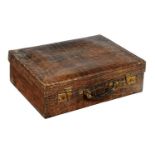 A VICTORIAN CROCODILE HIDE DRESSING CASE lined in green silk, the gilt brass locks stamped FINNIGANS