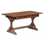 AN ENGLISH REFORMED GOTHIC OAK WRITING TABLE, C1870  fitted with two drawers on trestle ends with