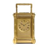 A FRENCH GILT BRASS CARRIAGE CLOCK, LATE 19TH C  with matt gilt mask dial and blued steel hands, the