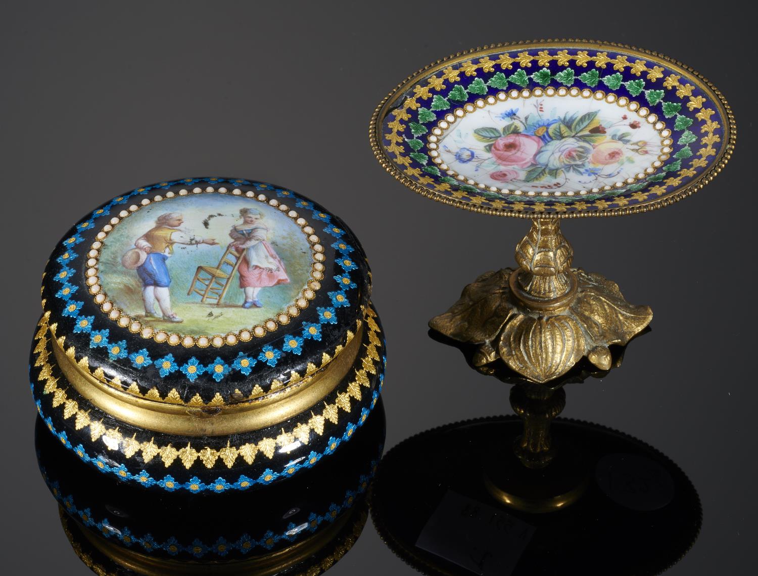 A FRENCH GILTMETAL AND ENAMEL BOX, LATE 19TH C  of round cushion shape, the lid painted with an 18th