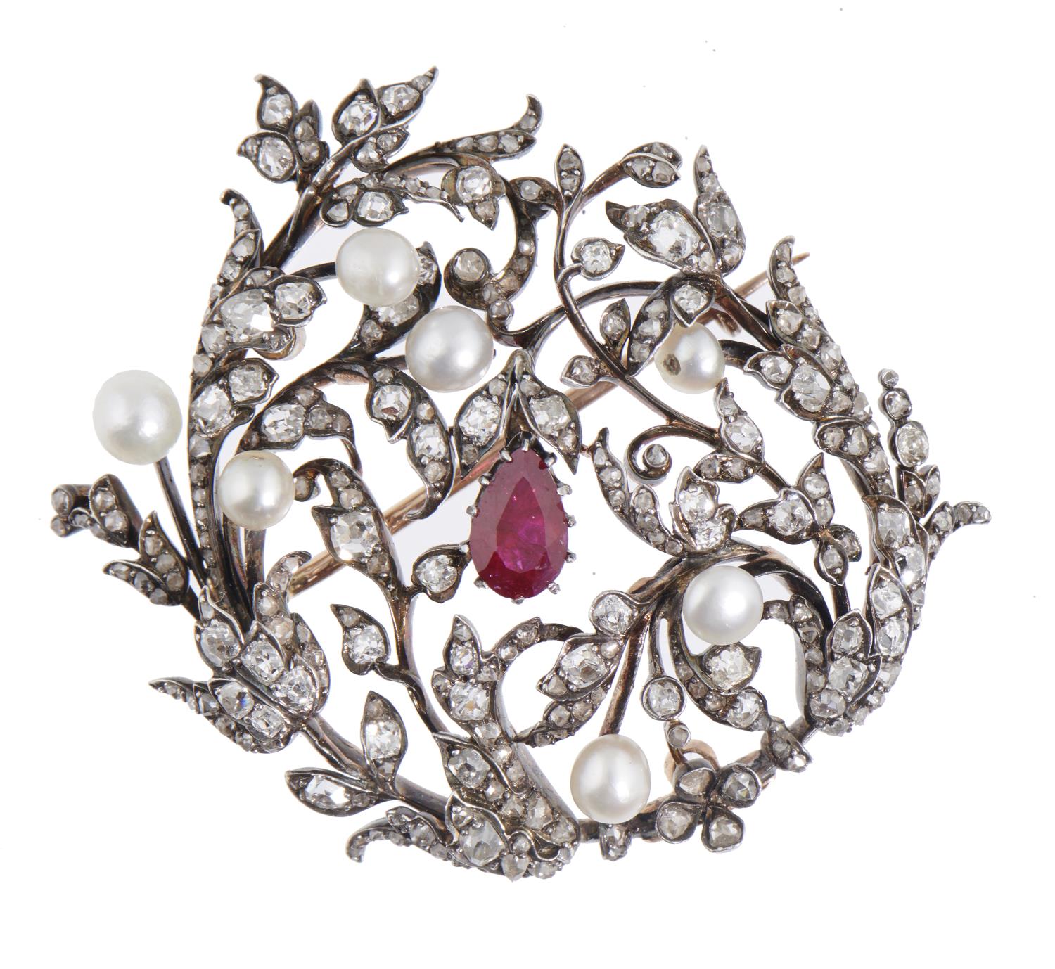 A RUBY, DIAMOND AND PEARL BROOCH-PENDANT, EARLY 20TH C  of scrolling openwork design, the larger