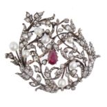 A RUBY, DIAMOND AND PEARL BROOCH-PENDANT, EARLY 20TH C  of scrolling openwork design, the larger