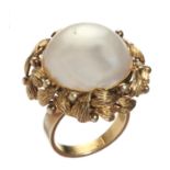 A MABE PEARL RING  hemispherical, in gold with leaf chased surround and plain hoop, marked 585, 16.