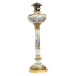 A FRENCH GILT BRASS MOUNTED PORCELAIN OIL LAMP, C1890  the scroll moulded fount, column and ogee