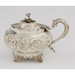 A  WILLIAM IV COMPRESSED GLOBULAR SILVER MUSTARD POT  with scalloped rim, chased with flowers and