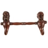 A SWISS OR GERMAN CARVED AND STAINED WOOD ANTHROPOMORPHIC DOUBLE COAT HOOK  38.5cm l Good condition