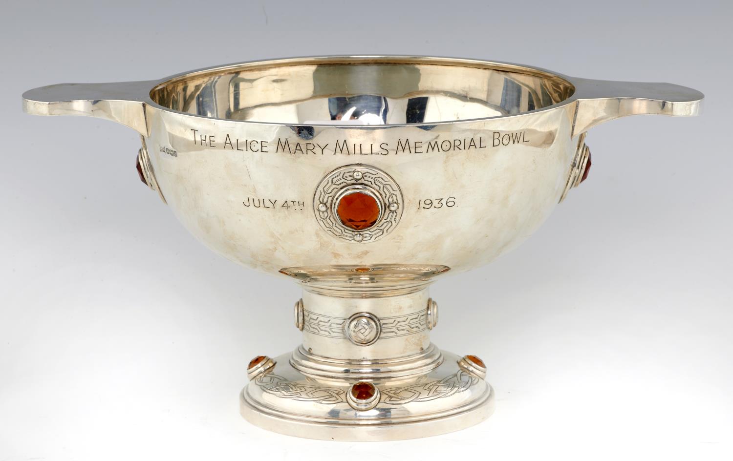 A GEORGE V CELTIC REVIVAL SILVER TROPHY  in the form of a quaich set with citrines, 39cm over
