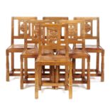A SET OF SIX WILF 'SQUIRREL MAN' HUTCHINSON OAK DINING CHAIRS with carved rose splat and brass