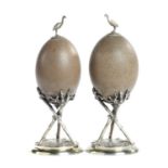 AUSTRALIA INTEREST. A PAIR OF VICTORIAN EPNS MOUNTED EMU EGG ORNAMENTS, C1870 with emu finial,