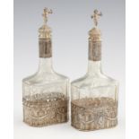 A PAIR OF CONTINENTAL SILVER MOUNTED ENGRAVED GLASS DECANTERS AND STOPPERS, LATE 19TH C with figural