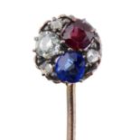 A GOLD STICKPIN, EARLY 20TH C   with diamond, ruby and sapphire terminal, head 0.8cm, 8cm, 2.8g Good