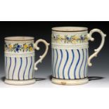 TWO GRADUATED CYLINDRICAL PRATT WARE WINCHESTER MEASURES, C1830 moulded with trailing flowers in a