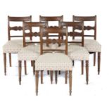 A SET OF SIX GEORGE IV MAHOGANY DINING CHAIRS, C1830  with roundel centred backrail, on turned legs,