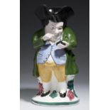 A SCOTTISH EARTHENWARE SNUFF TAKER TOBY JUG, SECOND HALF 19TH C  24cm h Good condition, no