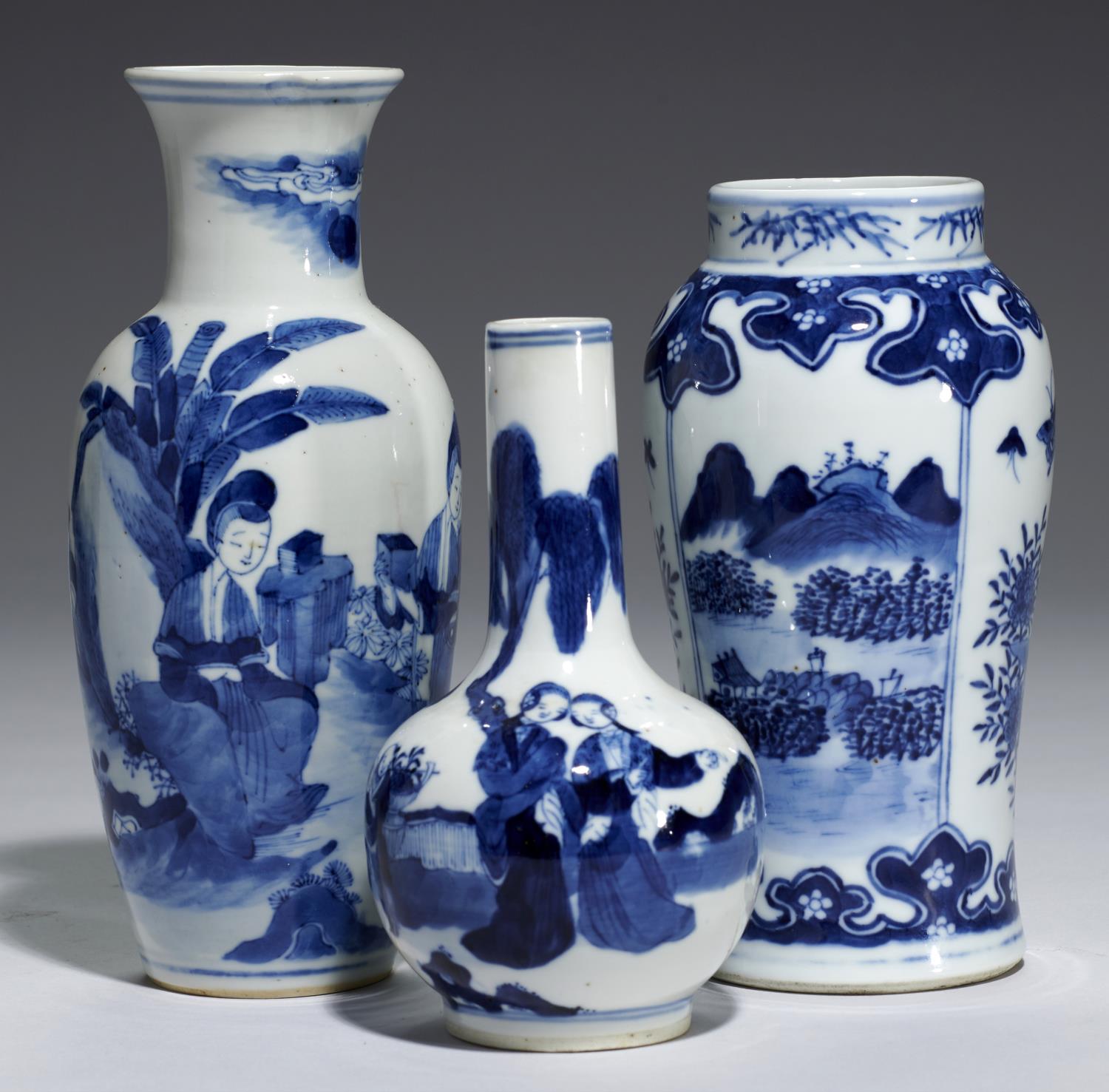 THREE CHINESE BLUE AND WHITE VASES, QING DYNASTY, 19TH C painted with groups of ladies, one with a