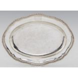 A GEORGE III GADROONED SILVER SECOND COURSE DISH FROM A DINNER SERVICE  engraved with armorials,