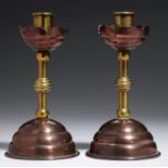 A PAIR OF  AESTHETIC MOVEMENT COPPER AND BRASS CANDLESTICKS BY BENHAM & FROUD, C1886  16cm h, iron
