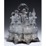 A VICTORIAN CUT GLASS SEVEN BOTTLE CRUET AND CONTEMPORARY PIERCED EPNS STAND, C1870  27cm h