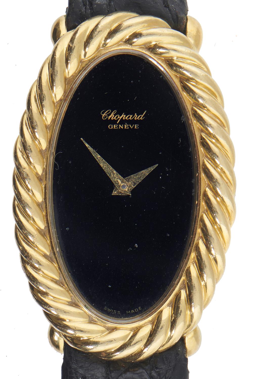 A CHOPARD OVAL 18CT GOLD LADY'S WRISTWATCH Ref  87122/50571, No 15477261, with black dial, 2.3 x 3.