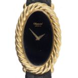 A CHOPARD OVAL 18CT GOLD LADY'S WRISTWATCH Ref  87122/50571, No 15477261, with black dial, 2.3 x 3.