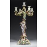 A GERMAN OR AUSTRIAN FLORAL ENCRUSTED PORCELAIN CANDELABRUM, C1900 with the figure of a flower