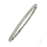 A DIAMOND SLAVE BANGLE, SECOND QUARTER 20TH C  with millegrain old cut diamonds, in platinum,  8.5cm