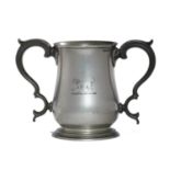 AN ENGLISH BALUSTER PEWTER LOVING CUP, 1836-63  finely engraved with Talbot crest, glass bottom,