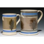 TWO  SWANSEA AND BOVEY TRACEY POTTERY CO MOCHA WARE MUGS, 19TH C  quart and pint, sprigged with